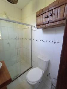 a bathroom with a toilet and a shower at Suite 1 in Marau