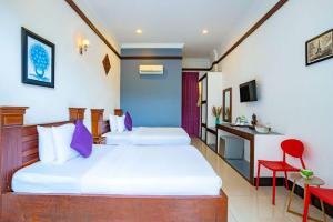Kampot View Boutique客房内的一张或多张床位