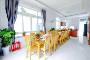 a dining room with a table and chairs at The Luka Pool Villa Vung Tau in Vung Tau