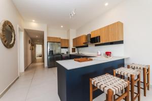 Η κουζίνα ή μικρή κουζίνα στο Apartment Beachfront Ocean Terraces Residence, Poste Lafayette-Apt-C2