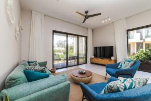 Μια τηλεόραση ή/και κέντρο ψυχαγωγίας στο Apartment Beachfront Ocean Terraces Residence, Poste Lafayette-Apt-C2