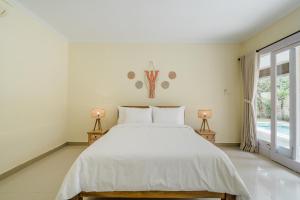 Ένα ή περισσότερα κρεβάτια σε δωμάτιο στο Villa Melati - Seminyak +21 φωτογραφίες