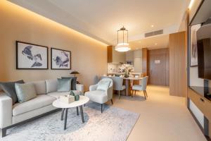 a living room with a couch and a table at Address Dubai Opera Residences in Dubai