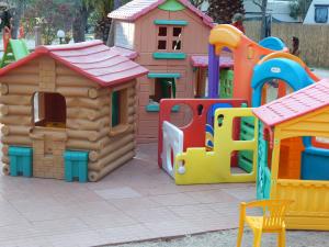 a bunch of play structures in a playground at Maronda Camping in Marina di Montenero