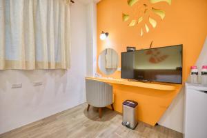 TV a/nebo společenská místnost v ubytování Easy Stay B&B