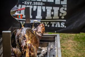 a roast turkey being cooked on a grill at Weldborough Hotel in Weldborough