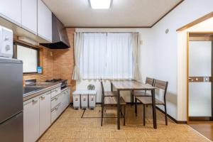 a kitchen with a table and chairs in a room at Tokyo Skytree Residence Inn (F2) in Tokyo