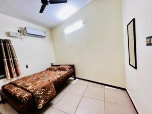 Postel nebo postele na pokoji v ubytování Lumina Home Stay