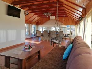 a living room with a couch and a table at Apartman LELI in Kupres