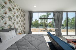 Letto o letti in una camera di Pran Riverside