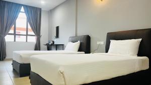 Postel nebo postele na pokoji v ubytování SiN LiEN HOTEL
