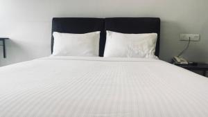 Postel nebo postele na pokoji v ubytování SiN LiEN HOTEL