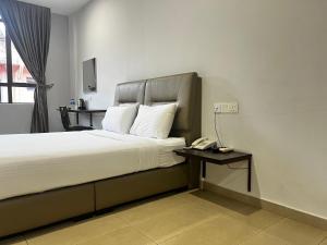 Postel nebo postele na pokoji v ubytování SiN LiEN HOTEL