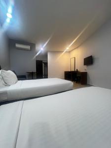 Postel nebo postele na pokoji v ubytování SiN LiEN HOTEL