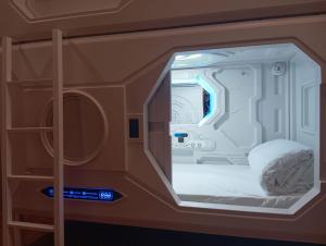 a small room with a bed in an airplane at Al Qudra Lakes Camping by Hyba in Dubai +23 photos