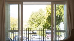 a balcony with a view of a parking lot at Luxury on the Esplanade #4 in Queenstown