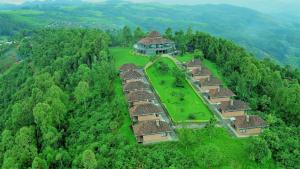 an aerial view of a village in the middle of a forest at Nyungwe Hill View Hotel in Rwumba