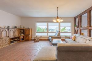 a living room with a couch and a table at Ferienwohnung Erika in Dassow +58 photos