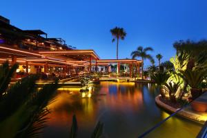 a large building with a river in front of it at Four Seasons Hotel in Limassol