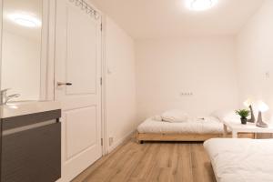 Ένα ή περισσότερα κρεβάτια σε δωμάτιο στο Canal House Haarlem