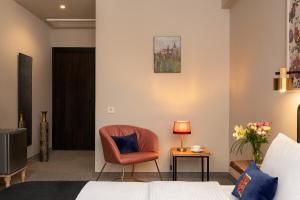 TV a/nebo společenská místnost v ubytování Galavani By Vintage Hotel Collections
