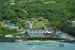 an island with houses and boats in the water at The Atlantis Historic Inn in Saint Joseph