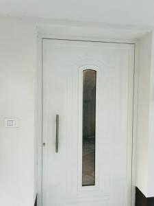 a white door with a window in a room at Élite in Gaeta