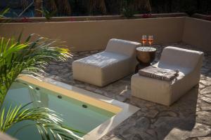 Гостиная зона в Elounda Infinity Exclusive Resort & Spa - Adults Only