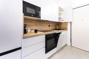 Kuchyň nebo kuchyňský kout v ubytování Loft 11 B + 28 fotografií