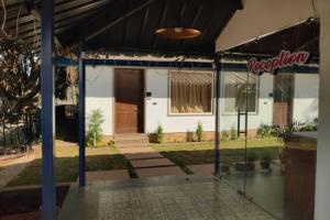 a house with a glass door in front of it at Midway Treat in Matkuli