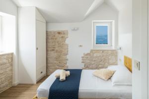 Postel nebo postele na pokoji v ubytování Villa Komelo