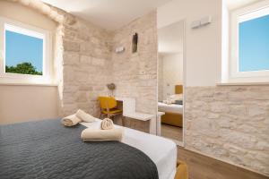 Postel nebo postele na pokoji v ubytování Villa Komelo + 37 fotografií