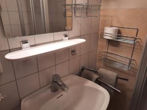 a bathroom with a sink and a mirror at Asbichlerhof in Bad Endorf +39 photos