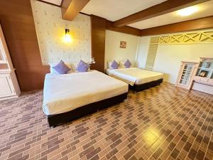 a bedroom with two beds in a room at I Talay Lodge Botique hotel in Rayong