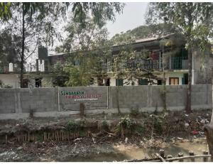 een gebouw met een bord ervoor bij Prakrity Village Resort Sundarbans, WB in Purbbadulki