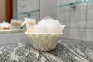 a basket filled with white yarn sitting on a counter at Spora Chata in Nowy Targ