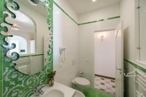 a bathroom with a sink and a mirror at Il Barilotto in Positano