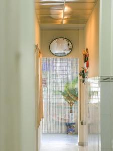 an open door to a room with a glass at Vit-xiem Room - Double room - Duck Homestay Ben Tre in Ấp Phú Lợi