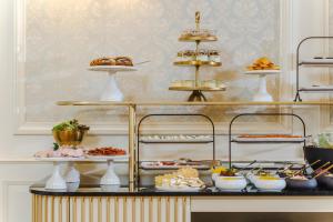 a buffet with various food items on display at Hotel Unicus Palace Old Town in Kraków