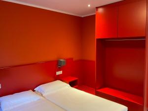 Ένα ή περισσότερα κρεβάτια σε δωμάτιο στο Hotel Liberty Self Check-In