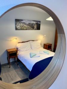 Katil atau katil-katil dalam bilik di Le murmure de l'Isère