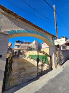 a bridge with a gate with a green van under it at Glorious House Goreme in Nevşehir