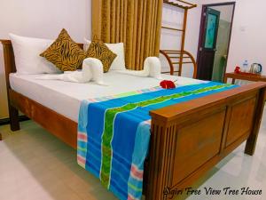 Letto o letti in una camera di Sigiriya Free View Tree House & Villa