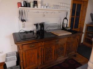 a kitchen counter with a coffee maker on top of it at Maisonette-Appartment in historischem Ambiente in Iphofen