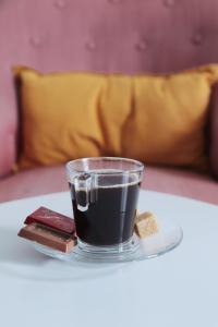 a cup of black coffee on a table at Beau studio proche gare in Gagny +13 photos