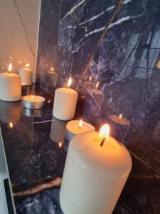 a group of candles sitting on top of a counter at Appartement Tours centre in Tours +13 photos