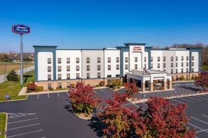 a rendering of a large white building with a parking lot at Hampton Inn & Suites Richmond in Richmond