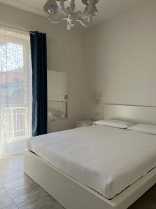 Postel nebo postele na pokoji v ubytování FLORA