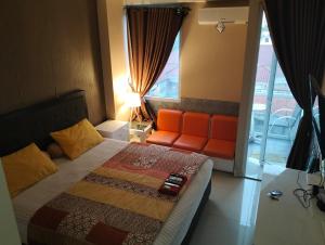 Postel nebo postele na pokoji v ubytování The alt room by Vivo apartemen