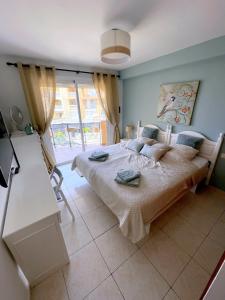 Postel nebo postele na pokoji v ubytování Tropical Holiday Apartment